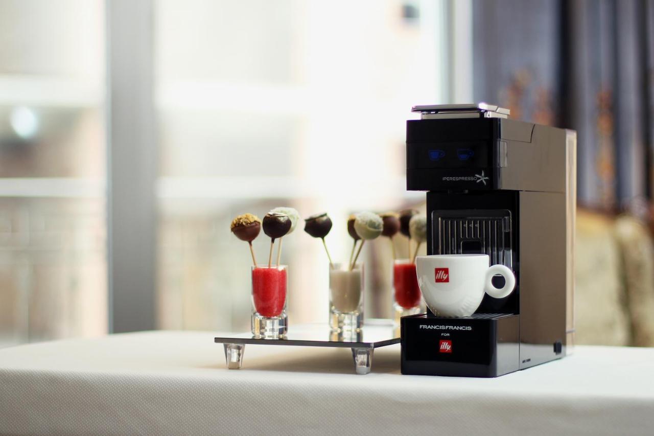 Orion Hotel Bishkek Exterior foto A Nespresso Vertuoline coffee machine